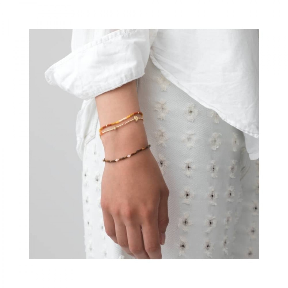 anni lu tie dye bracelet - golden amber - model arm